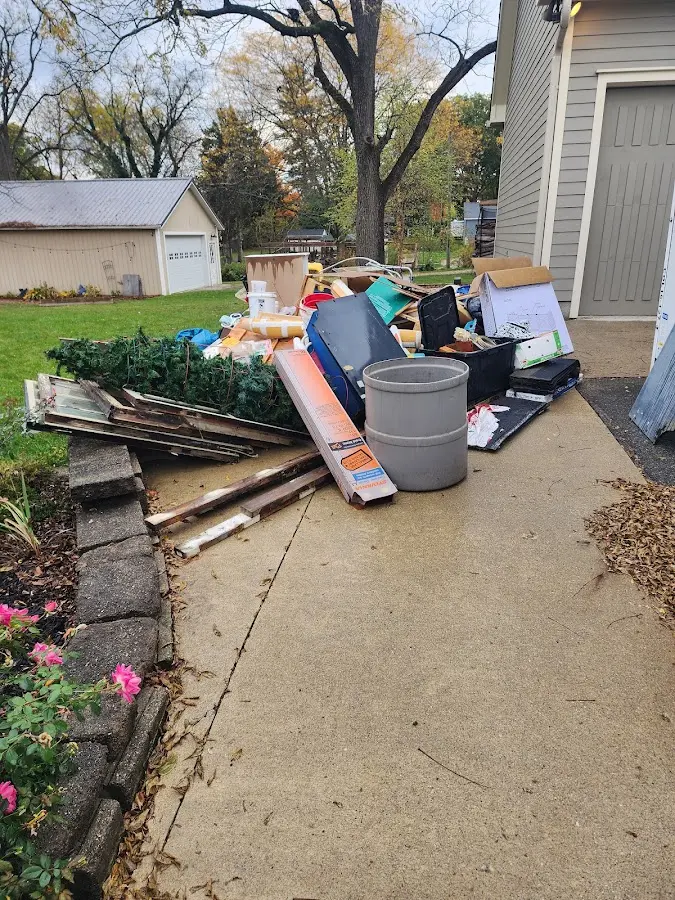 Dumpster being loaded with debris for Roofing Dumpster Rental in Leacock